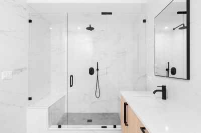 Walk-in Shower Featuring Black Frame Glass